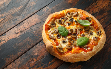 Hot Mushroom Pizza on wooden table. ready to eat. vegetarian food
