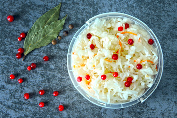 Sauerkraut. Fermented products for health. Sauerkraut with cranberries and spring onions. Probiotics.