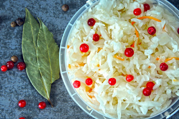 Sauerkraut. Fermented products for health. Sauerkraut with cranberries and spring onions. Probiotics.