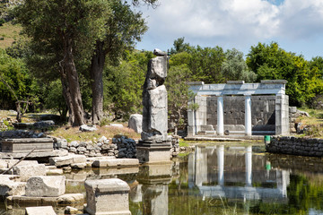 Ancient city of Kaunos, Dalyan valley, Turkey. Kaunos (Latin: Caunus) was a city of ancient Caria and in Anatolia, a few km west of the modern town of Dalyan, Muğla Province, Turkey.
