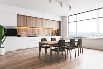 White and wood loft kitchen corner with table