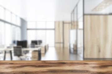 Gray and wooden open space office blurred