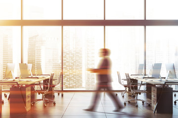 Businessman walking in panoramic office