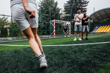Soccer player with ball in action outdoors. Team play concept. Training time.