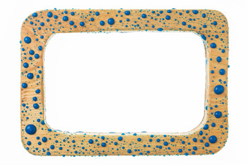 Beautiful colorful water droplets on a wooden frame. Blue drops of paint.