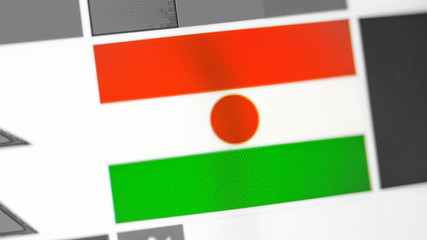 Niger national flag of country. Niger flag on the display, a digital moire effect.