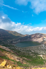 Beautiful view of Okama crater lake at Mount Zao in summer sunny day. active volcano in Miyagi Prefecture, Japan