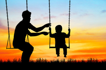 silhouette  Father and son  happy in playground