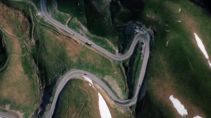 Aerial view of winding curvy rural road in mountains of Georgia.