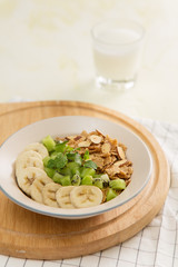 Healthy breakfast: corn flakes with milk and fresh fruits