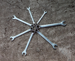 Wrenches, 7 pieces. Isolated on gray background. Different size. Copy space. There is a place for text.
