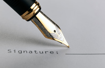 fountain pen on white paper with inscription signature
