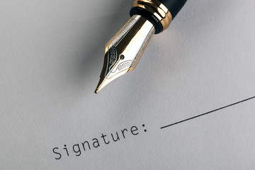 fountain pen on white paper with inscription signature