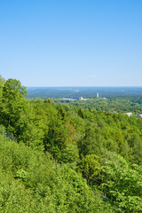 Fototapeta premium Mountain slope with a deciduous forest and beautiful view to the horizon