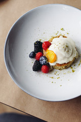 dessert with cream and berries