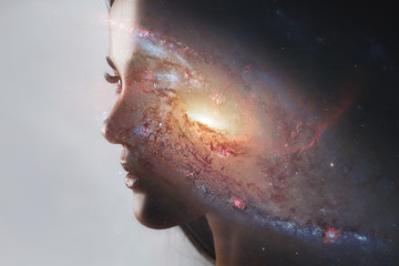 The universe inside us, the profile of a young woman and space, the effect of double exposure. scientific concept. The brain and creativity. Elements of this image furnished by NASA