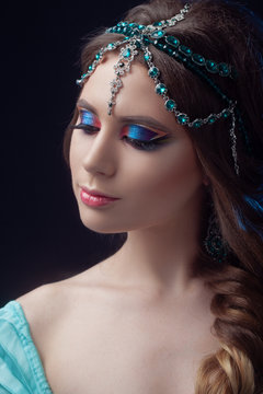 Prince Jasmine, a young woman in the image of an Eastern fairy Princess.