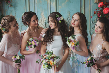 Beautiful young woman bride with friends. A wedding celebration