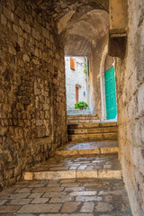 Romantic old narrow streets and passages in the old town od Sibenik in Croatia