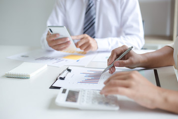 Fototapeta premium Both accountants have checked the company's finances. Have checked the work and profit of the company In order to plan for business expansion to the European zone and nearby areas