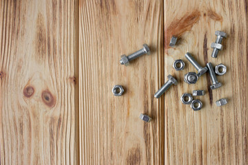 female screw on wooden background