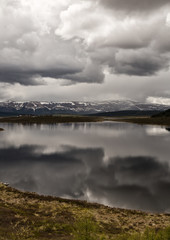 Mountain lake landscape with beautiful sky and storm clouds