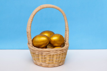 Golden eggs in the basket. Concept of wealth