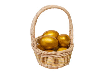 Golden eggs in a basket on a white background, isolate. Concept of wealth