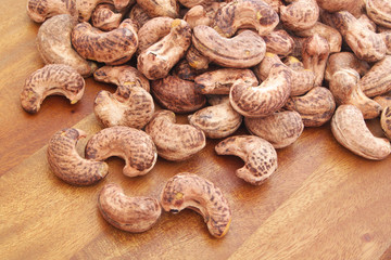 Cashew nuts on wooden board