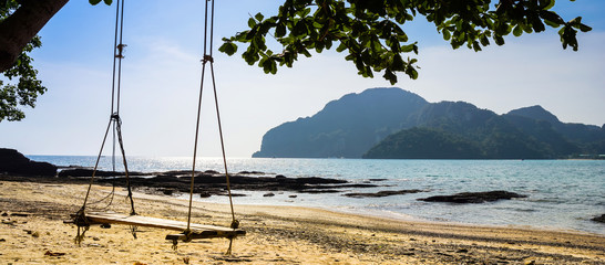 Swing hang from tree over beach, Island Koh Phi Phi Don, Krabi, South Thailand.