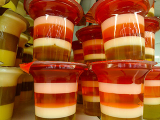 Jelly in a jar close-up on the counter of the store, dessert is delicious for children.
