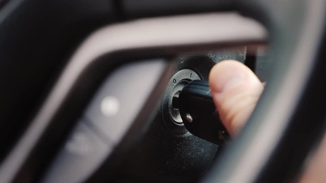 The ignition key is inserted into the well and start the car engine