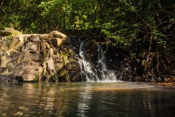 Obraz premium Ton Aow Yon Waterfall rich natural resources,in the forest,asia tropical areaat Island Phuket Thailand.