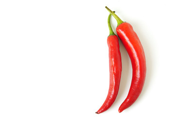 Two paprika pepper isolated on white background