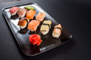 sashimi sushi set on black background