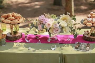 Festive wedding table, decorated with sweets and drinks
