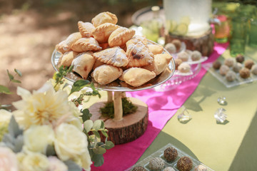 Festive wedding table, decorated with sweets and drinks