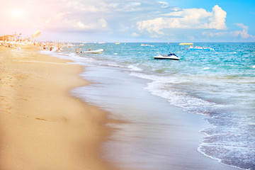 Blue soft waves roll on the Golden sand.