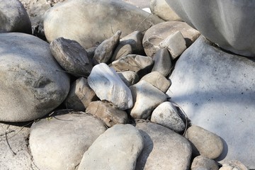 Texture of light smooth large sea stones
