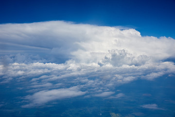 Lush white clouds view from the plane, great height.