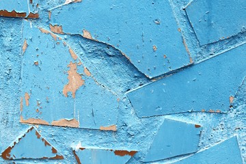 The texture of the old stone wall painted blue