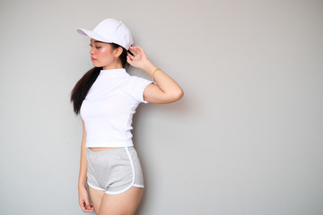Naklejka premium Asian girl in sportswear with cute expression.