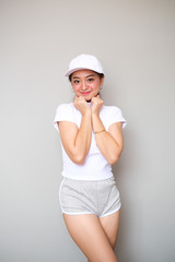 Asian girl in sportswear with happy expression.