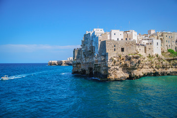 Coast of Polignano a Mare on sunny summer day, view from sea