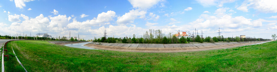 Fototapeta na wymiar Panorama near the Chernobyl nuclear power plant. The first second third and fourth power units. Arch confinement.