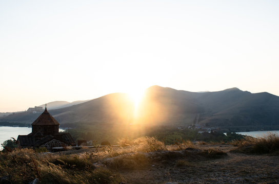 old Sevanavanq monastery in Sevan, Armenia while sunset