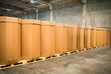 Stack of big industrial cardboard boxes. Craft Cargo Boxes stacked side by side in a factory