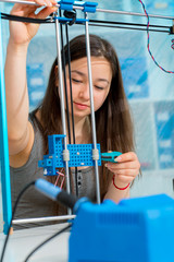 Schoolgirl in the classroom design and development of robots