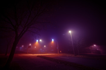 Fog at the crossroads in the night city