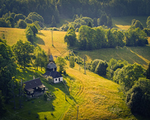 Aerial view of castle ruins Tolstejn with beautiful view to a chapel in Luzicke hory. Czech republic